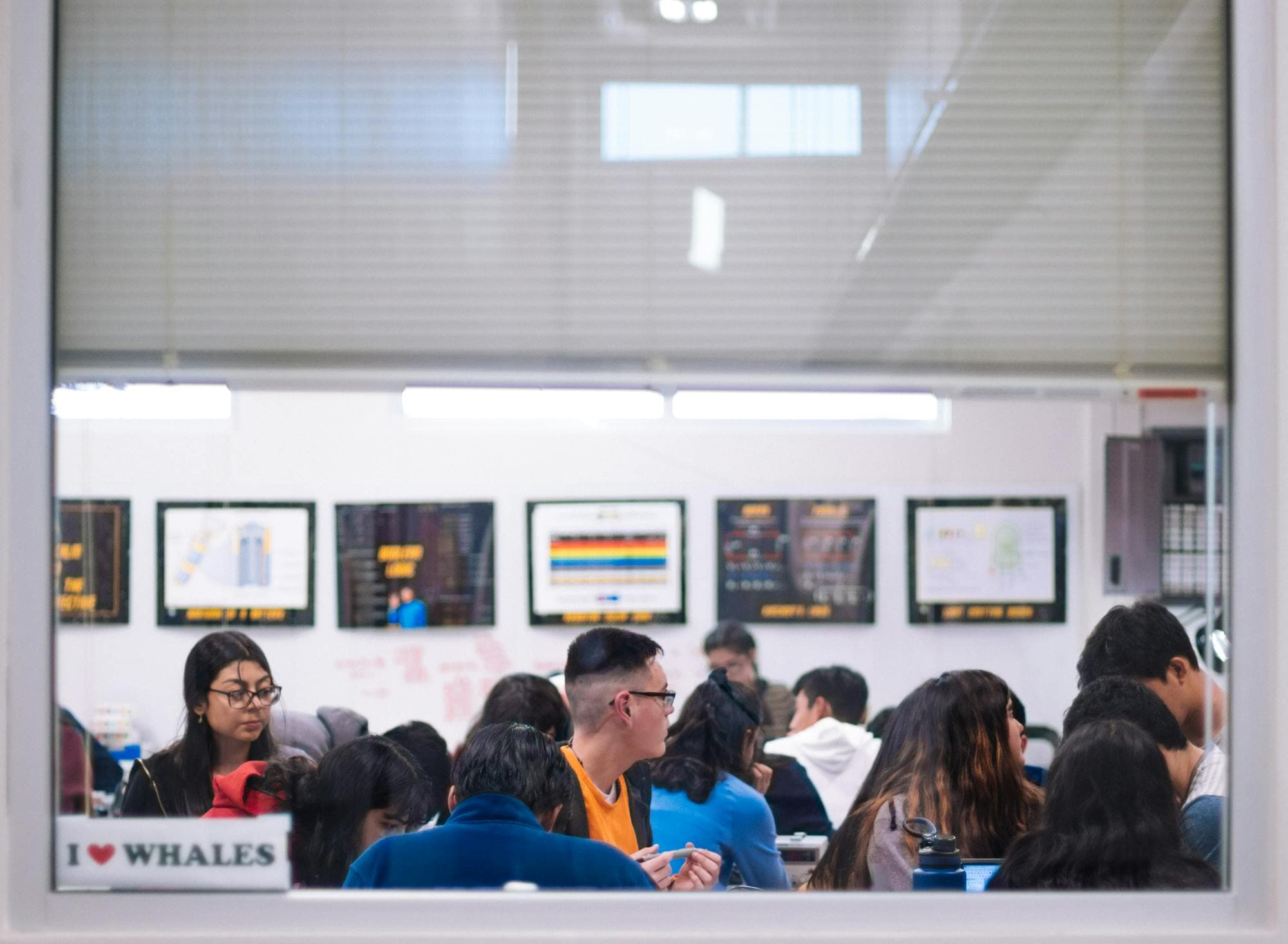 Secondary students learning together in a bright classroom