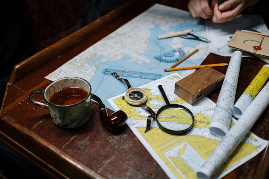 Maps, compass and notes laid out for route planning